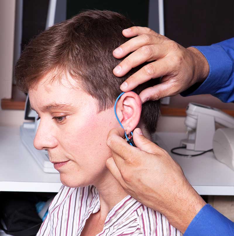 A Real Ear measurement test being performed by a hearing instrument specialist.